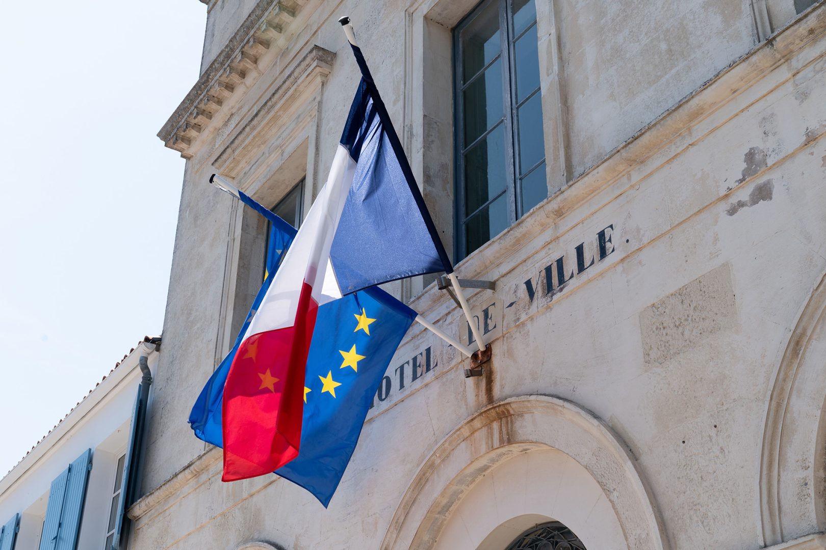 French and EU European Union flags on the city hall